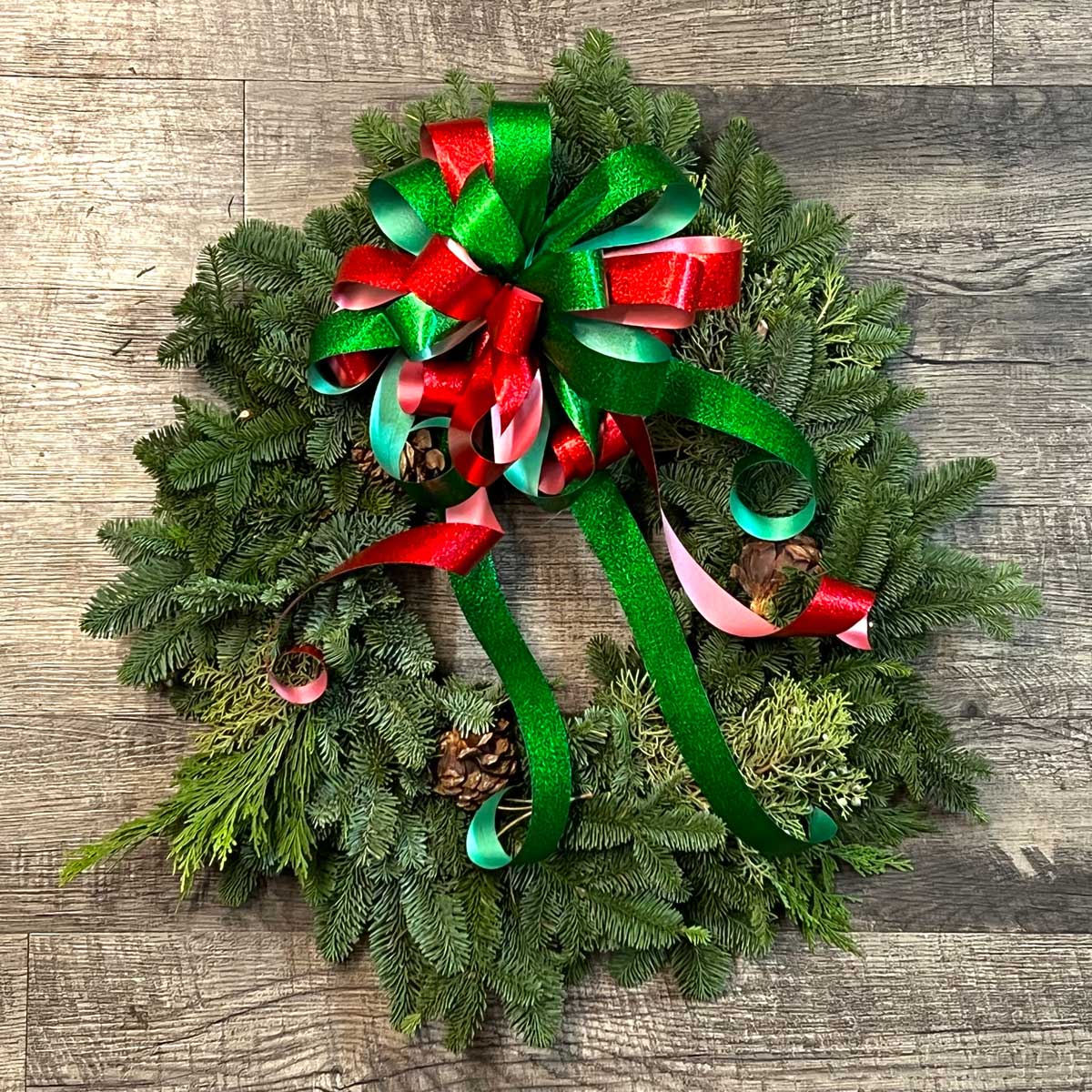 Calallen Christmas wreath with pinecones and holiday bow