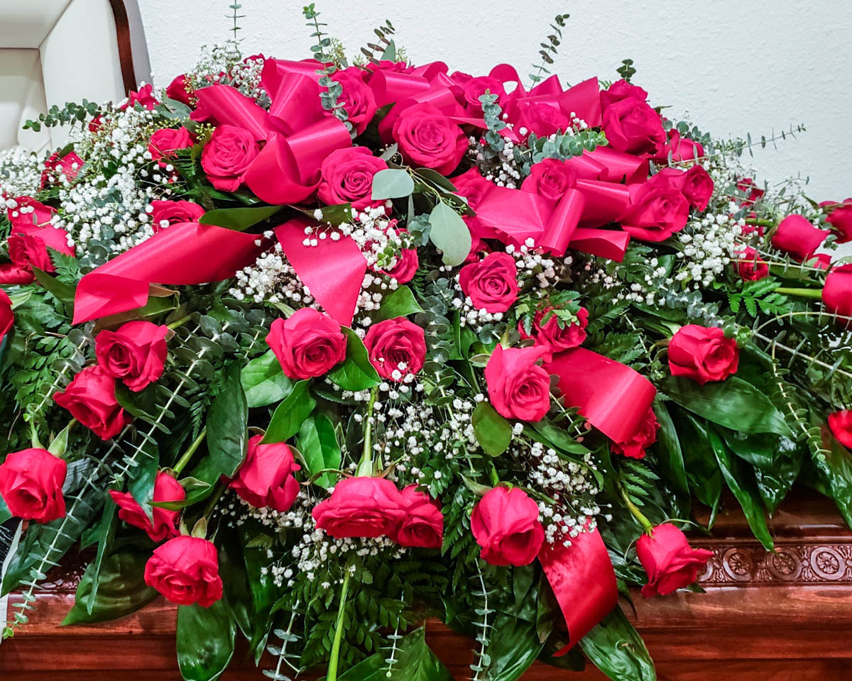 Classic red rose casket cover from Annaville Florist