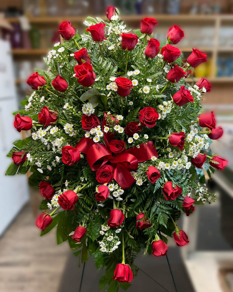 Classic red rose funeral spray from Annaville Florist
