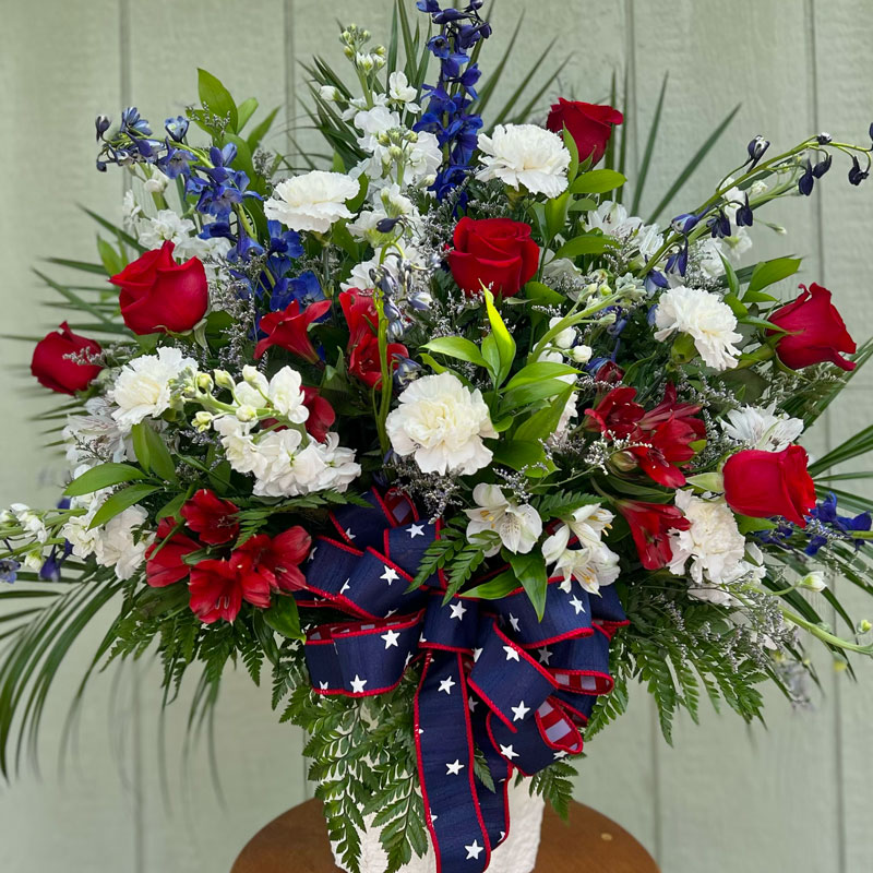 Red, white and blue patriotic funeral basket in Corpus Christi, Texas