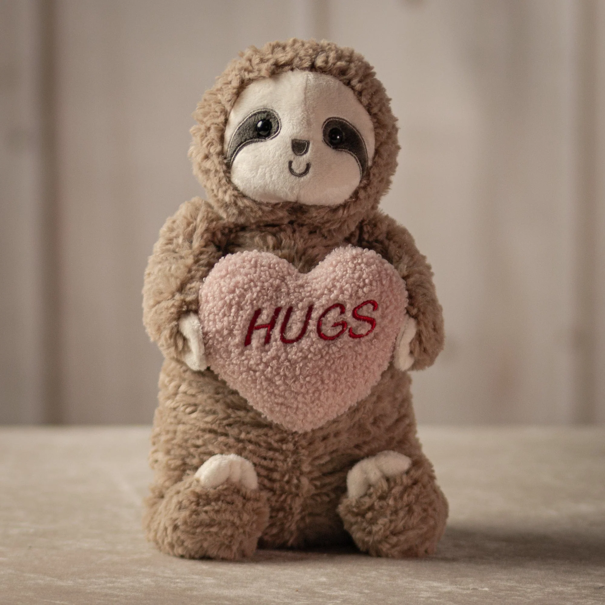 Furry Sloth stuffed animal with XOXO heart for Valentine's Day from Annaville Florist